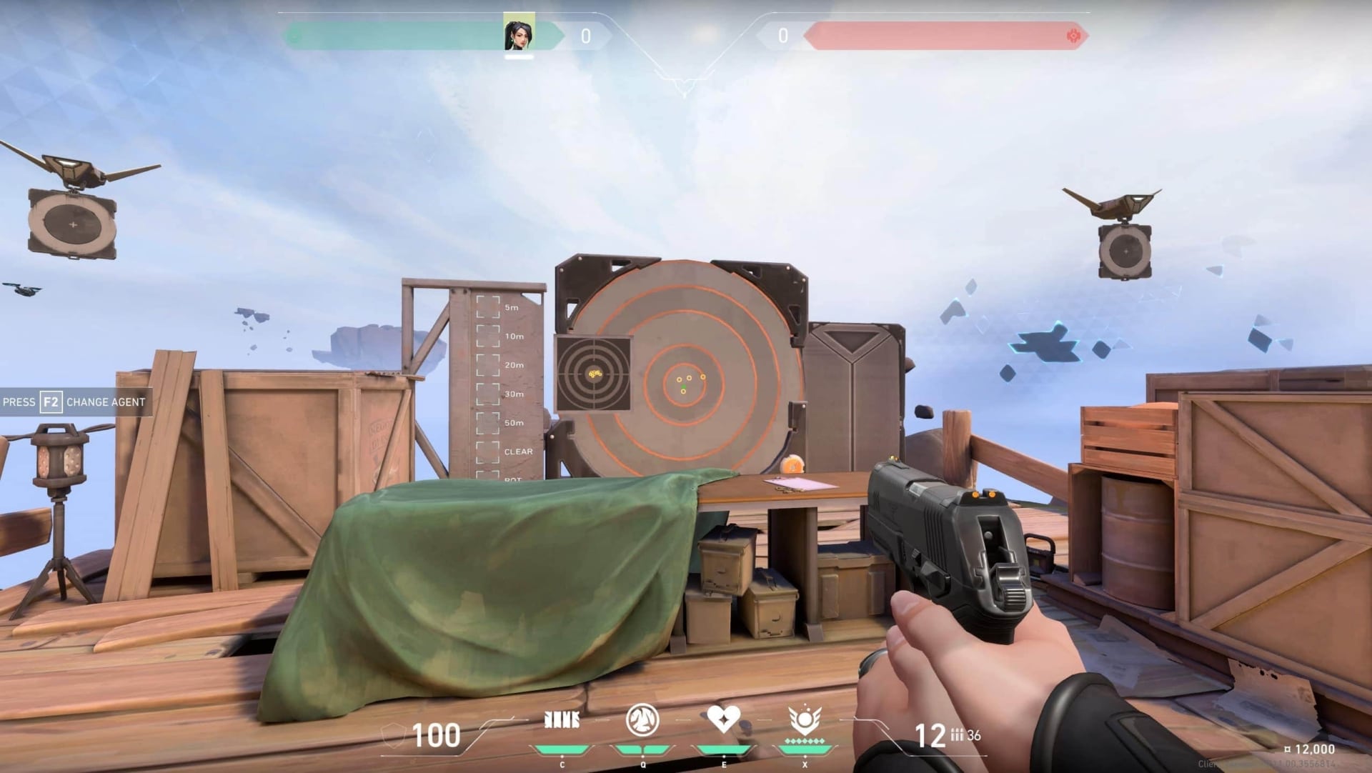 A characterer of VALORANT aims a pistol at a target marked with concentric circles, surrounded by wooden crates and drones