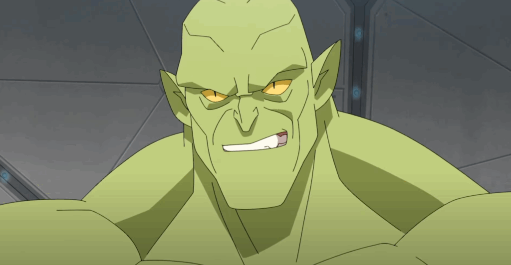 Monster Girl scowls menacingly. Green skin, pointed ears, and yellow eyes against a metallic background