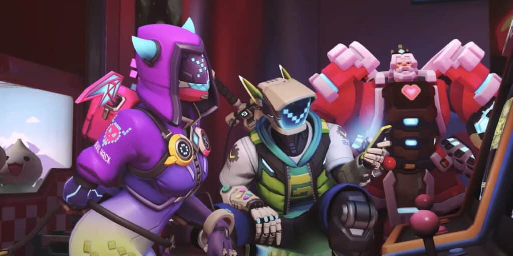 Three colorful characters from Overwatch 2 Season 17 battle pass gather around an arcade machine, showcasing a lively and fun gaming atmosphere