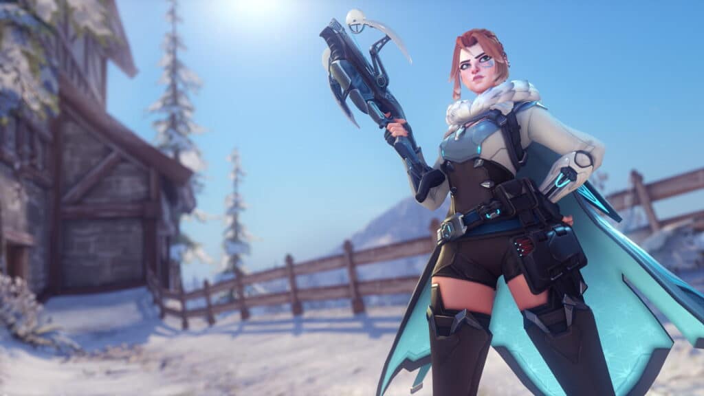 Freya in futuristic winter attire stands confidently in a snowy landscape. She holds a weapon, wearing a cape and armor. A wooden cabin and trees are in the background