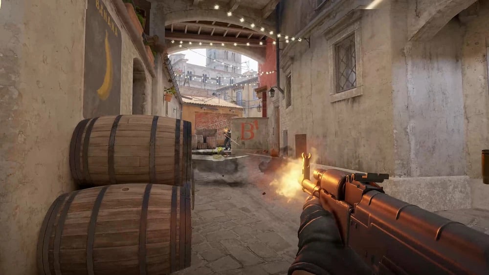 CS2 scene shows a player firing a gun in a narrow alley with barrels on the left