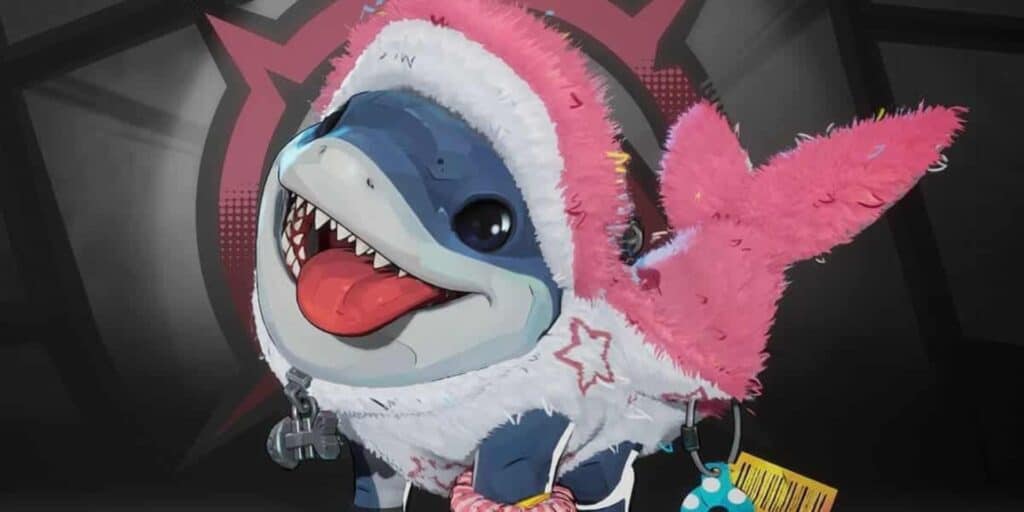 Jeff the Land Shark wearing a fluffy pink outfit with a hood and fish fin. The shark has a big smile and is sticking its tongue out