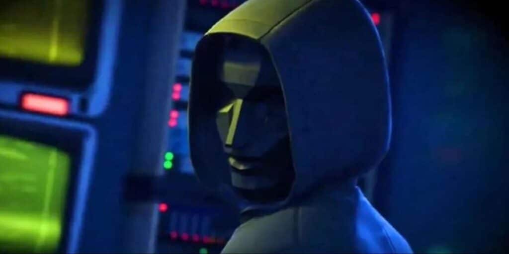 A hooded, robotic figure with a geometric face turns, surrounded by glowing green and red controls in a dimly lit futuristic setting.