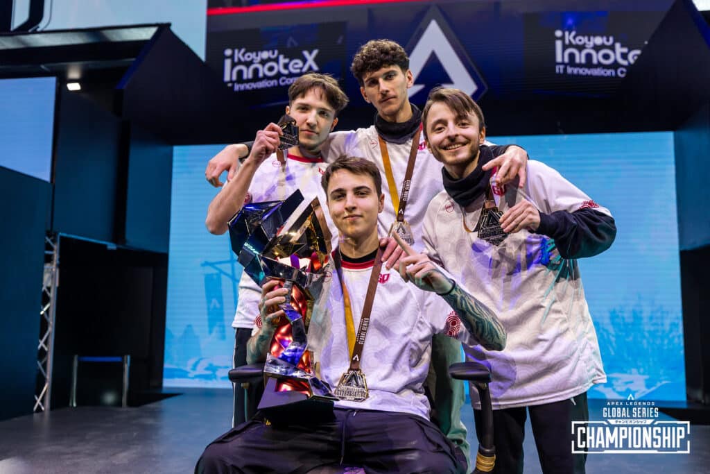 GoNext Esports roster and coach celebrating win and holding the trophy for ALGS Year 4 Championship on stage