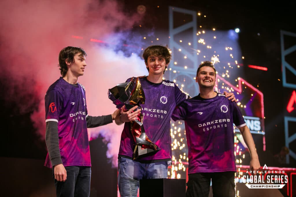 DarkZero Gaming trio hoisting the ALGS Year 2 Championship trophy on stage