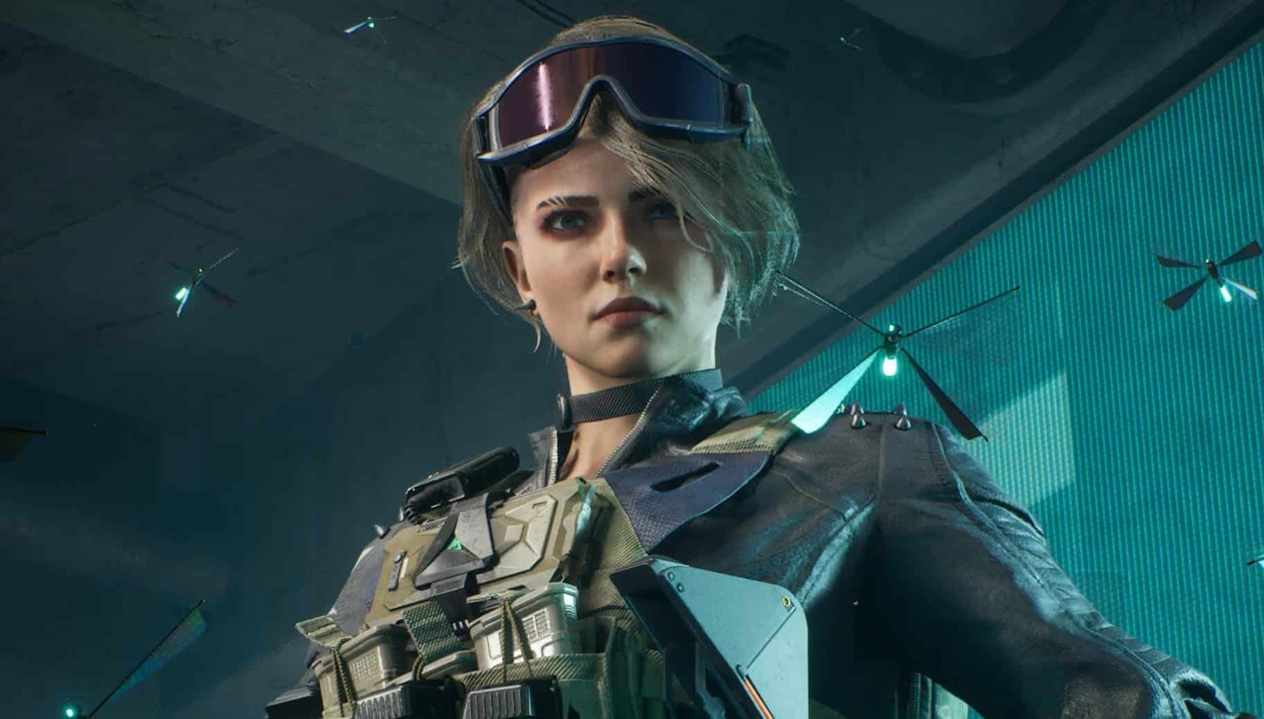 Toxik in military gear stands confidently, wearing goggles and a tactical vest