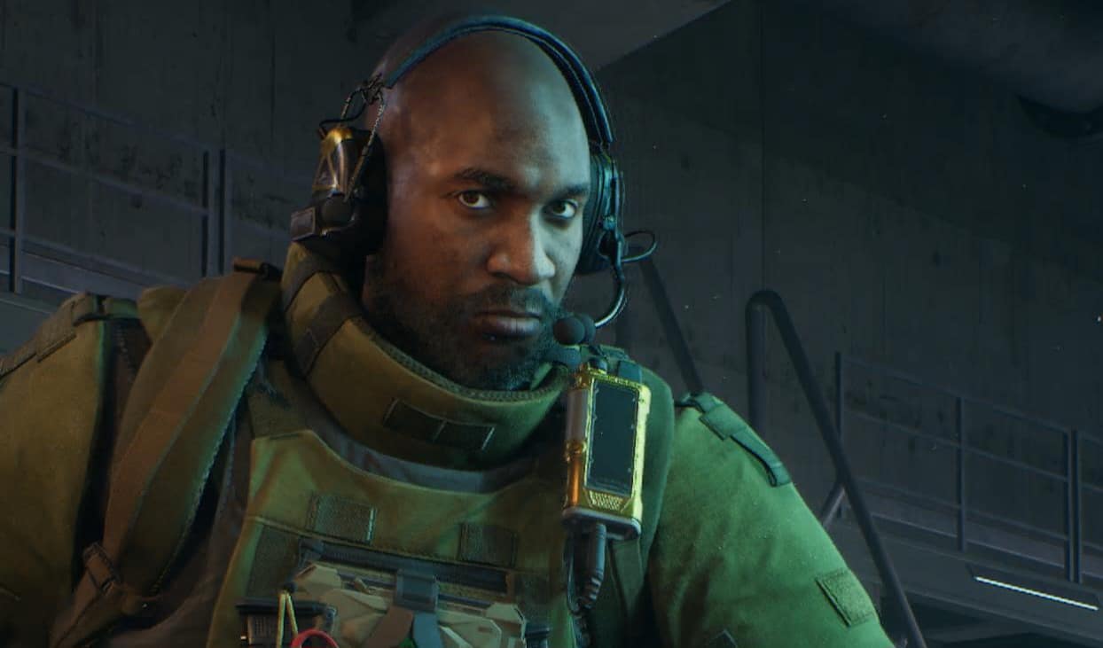 Shepherd from Delta Force wearing a headset, lit by cool blue lighting