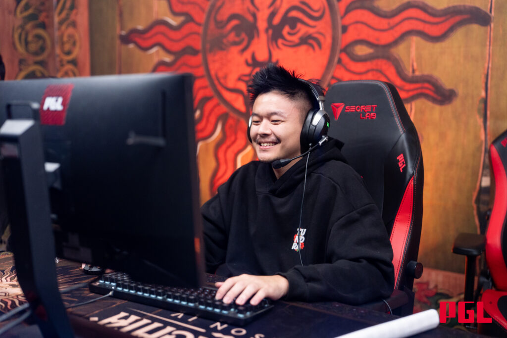 MidOne smiling at PGL Esports Dota 2 tournament